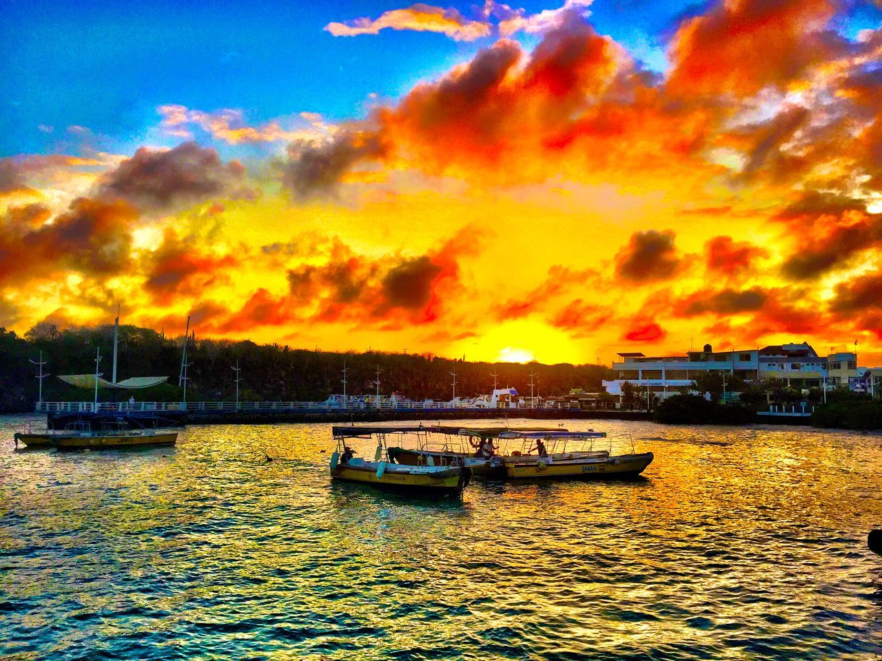 sunset, water, nautical vessel, transportation, mode of transport, sky, boat, waterfront, orange color, cloud - sky, beauty in nature, scenics, tranquility, sea, tranquil scene, moored, cloud, nature, rippled, idyllic