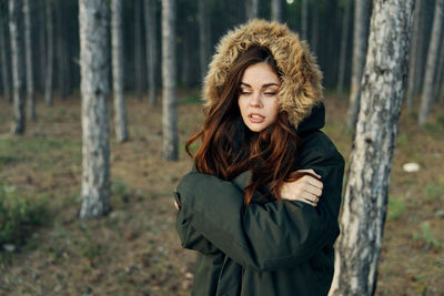 Beautiful young woman in forest