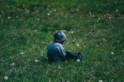 Child sitting on field