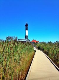 Lighthouse against clear blue sky