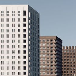 Low angle view of modern buildings against clear sky