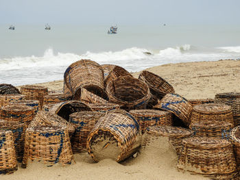 Fishing baskets lying on the beach in ada foah ghana west africa