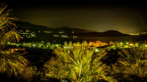 Scenic view of lake against sky at night