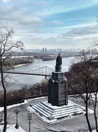 Scenic view of river against sky during winter