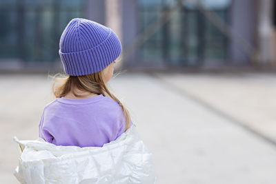 Rear view of girl wearing hat