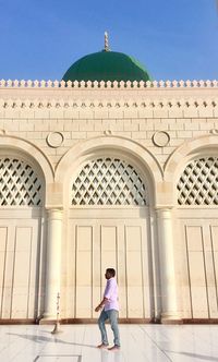 Full length of man standing on historic building