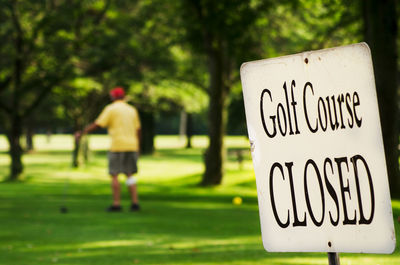 Man with text on grass