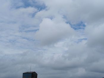 Low angle view of communications tower against sky