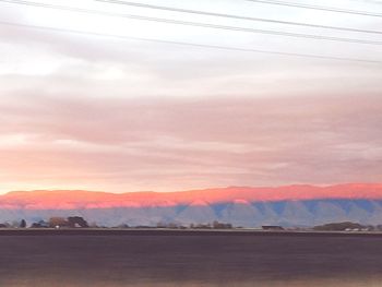 Scenic view of landscape against sky during sunset