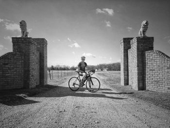 Man riding bicycle on street in city