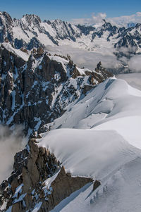 Snowy peaks and mountains in a sunny day, viewed from the aiguille du midi, near chamonix, france.