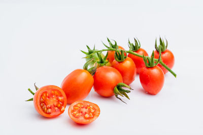 Close-up of tomatoes against white background