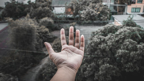 Midsection of person against building