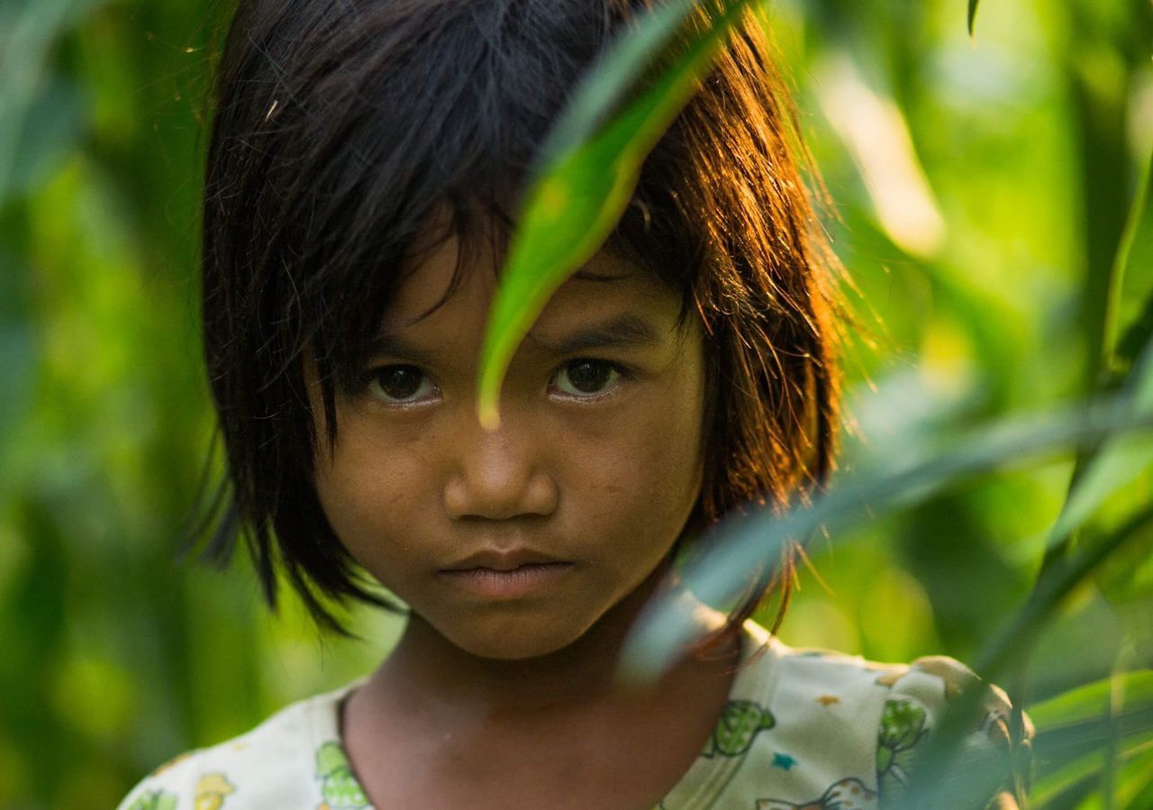 portrait, close-up, focus on foreground, headshot, cute, human face, day, green color, lifestyles, outdoors, nature, selective focus, growth