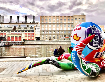 People against multi colored buildings in city