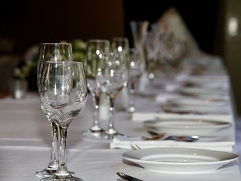 Close-up of glasses on table in restaurant