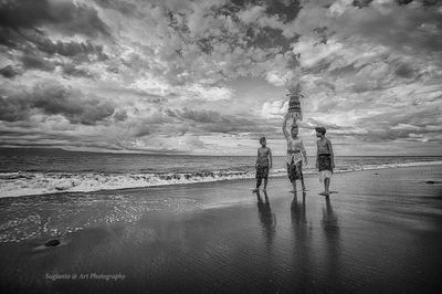 Scenic view of sea against cloudy sky