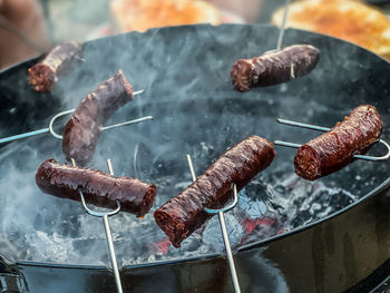 Close-up of meat on barbecue grill