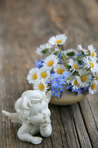 Close-up of white flowering plant on table