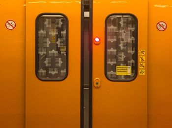 Close-up of text on yellow wall