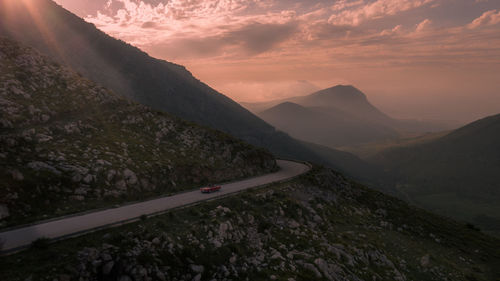 Scenic view of mountains against sky during sunset