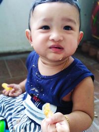 Portrait of cute boy eating food