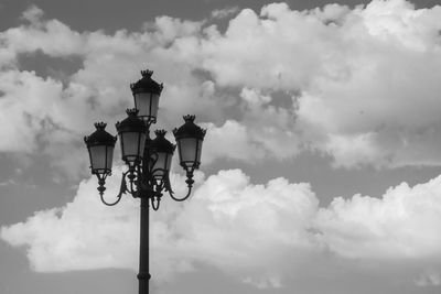 Low angle view of street light against cloudy sky. farola de la plaza mayor de valladolid.