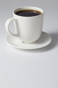High angle view of coffee cup on table