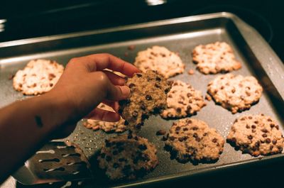 Oatmeal chocolate chip cookie in hand