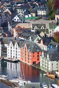 High angle view of river amidst buildings in town
