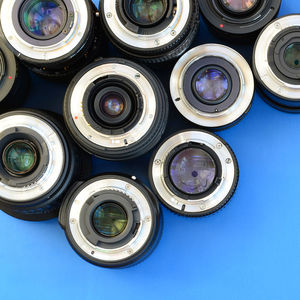 High angle view of lens on blue background