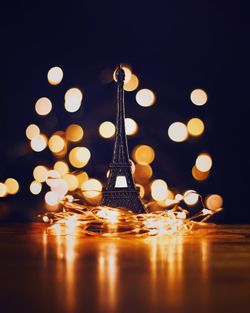 Close-up of illuminated lights on table