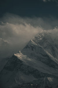 Scenic view of snowcapped mountains against sky during sunset