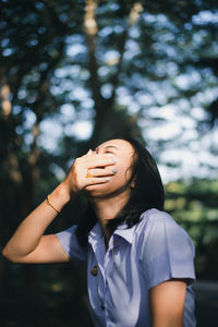 Portrait of young woman with eyes closed