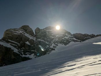 Scenic view of snowcapped mountains against sky during winter