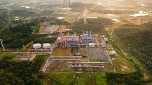 Aerial view of a gas turbine power plant station during sunrise.