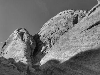 Low angle view of rock formation against clear sky