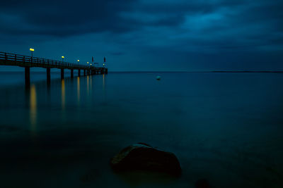 Scenic view of sea against sky at dusk