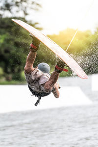 Man kiteboarding on sea