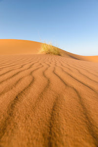 Scenic view of desert against clear sky