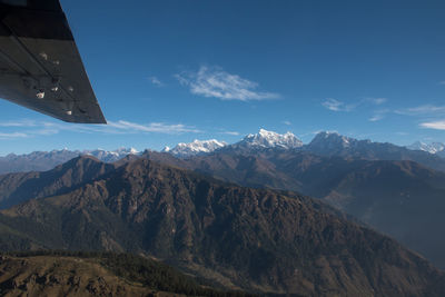 View of snowcapped mountain against cloudy sky