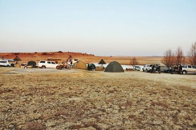 Scenic view of field against clear sky