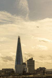 View of buildings against cloudy sky