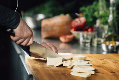 Man preparing food on cutting board