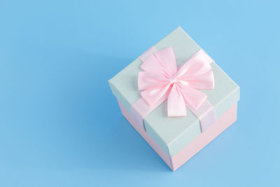 Directly above shot of gift box on blue background