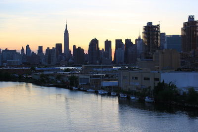 View of buildings in city at sunset