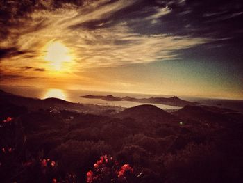 Scenic view of landscape against sky during sunset