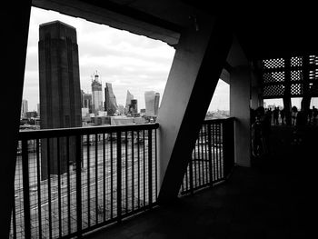 View of bridge and buildings against sky