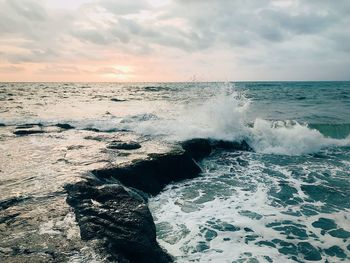 Scenic view of sea waves splashing on shore