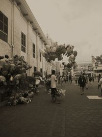 People walking in front of building